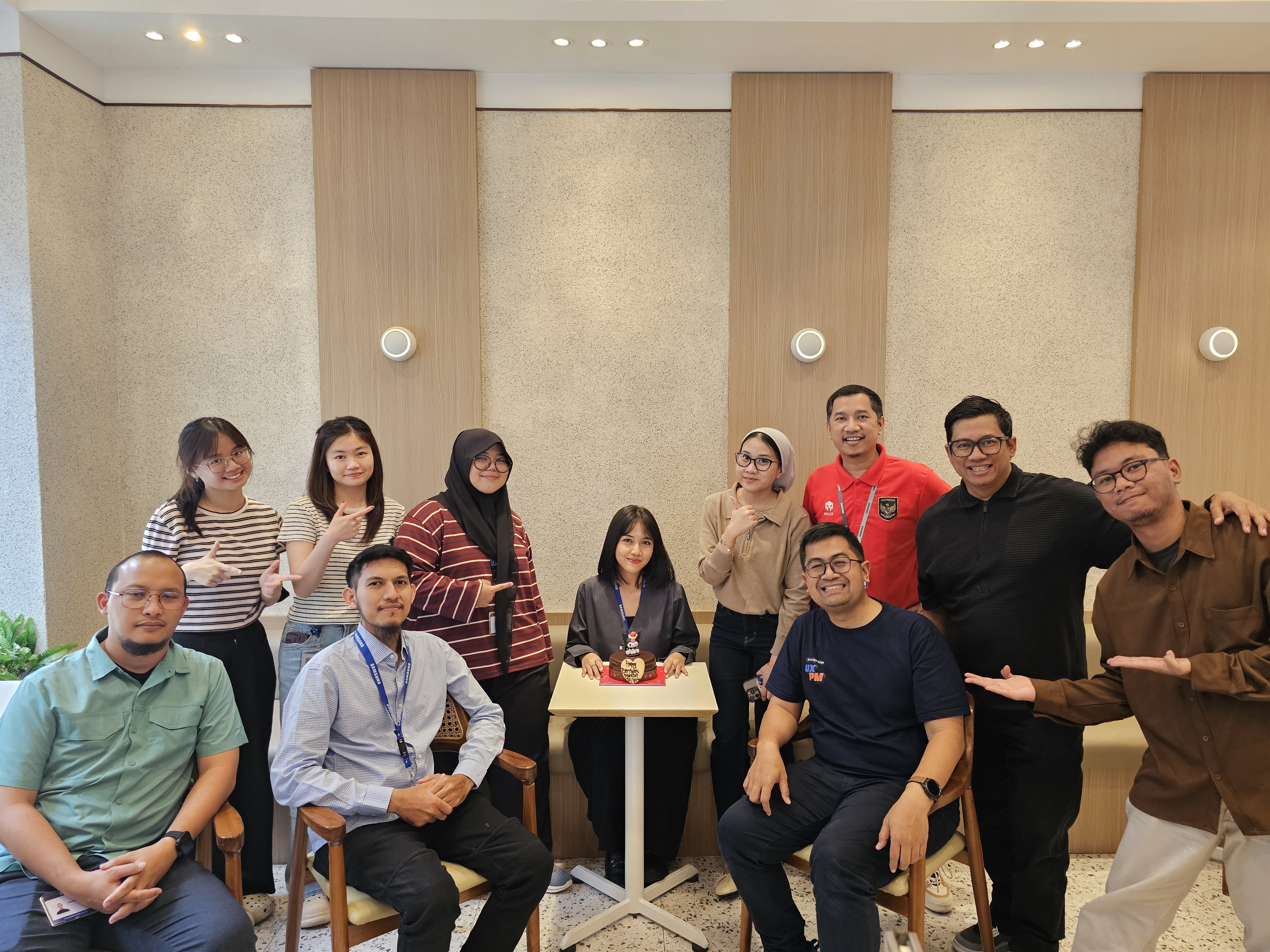The design team gathered together for a group photo